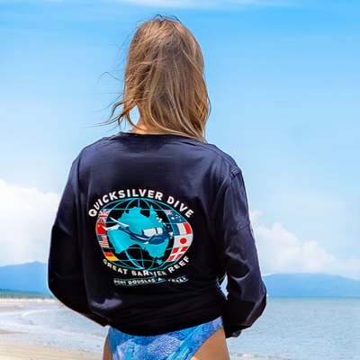Person wearing a Quicksilver Dive shirt with a scenic background