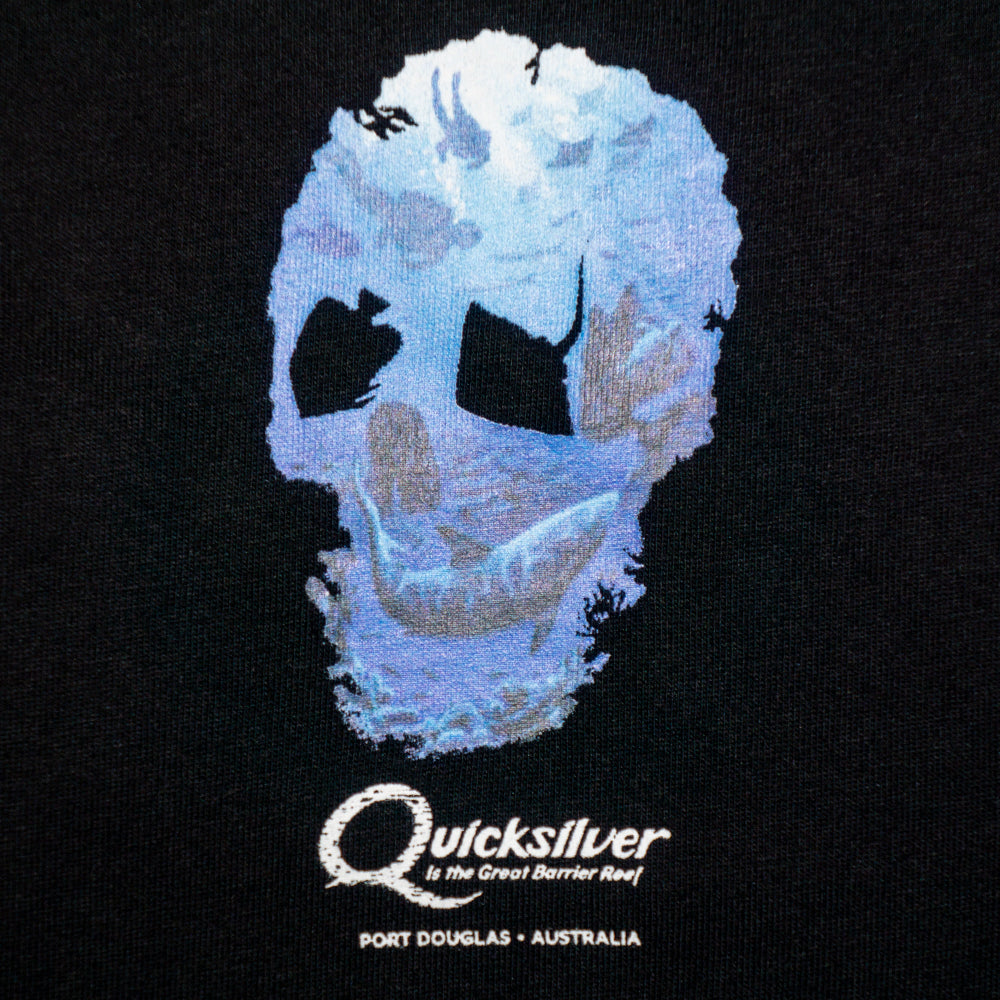 Black t-shirt with a blue skull design and Quicksilver branding on a black background